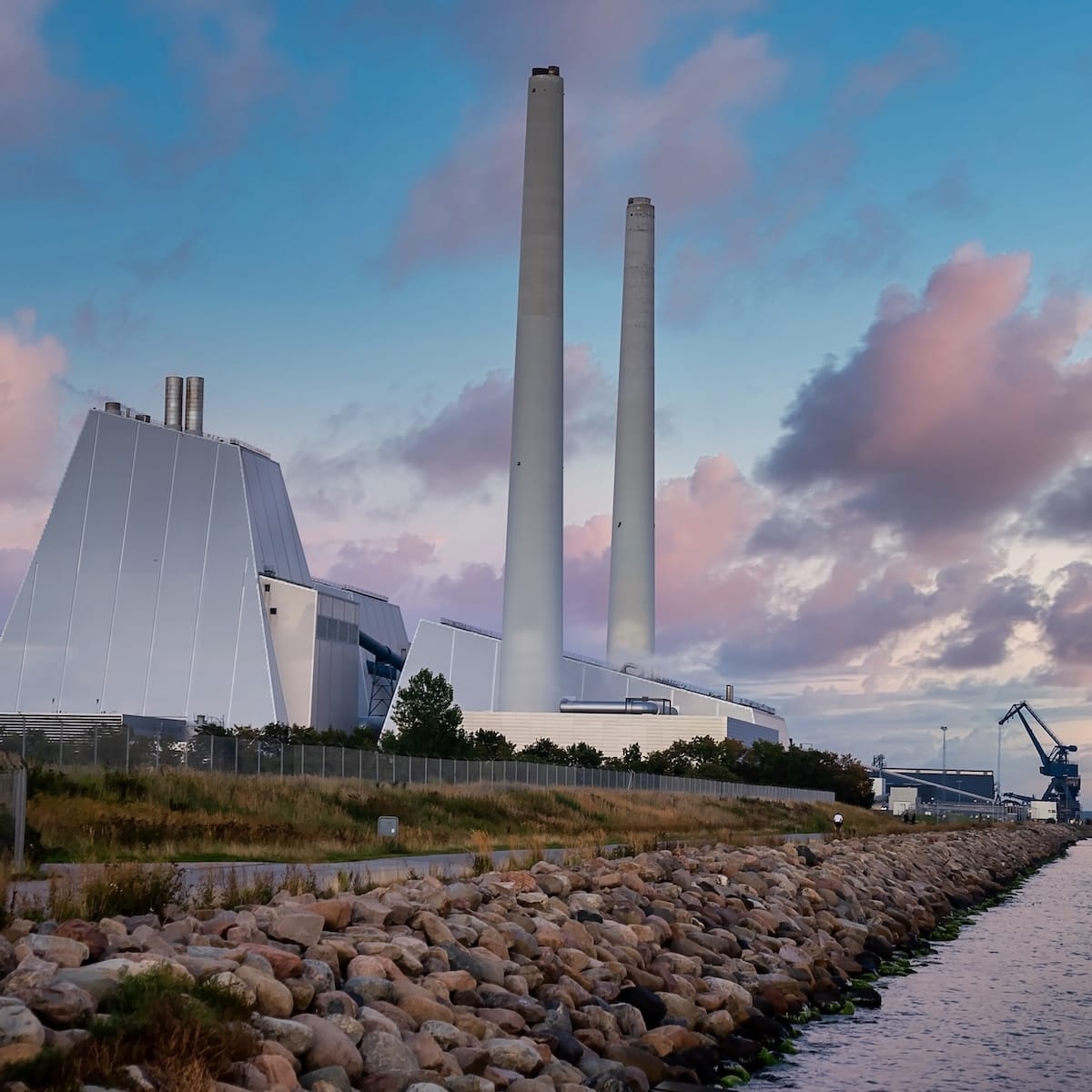 Industrial building on a coastline in the evening